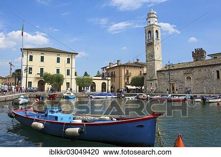 "Port of Lazise on Lake Garda, right the church of San Nicolo, Lazise, Italy, Europe" View Large Photo Image Stock Image - "Port of Lazise on Lake Garda, right the church of San Nicolo, Lazise, Italy, Europe". Fotosearch