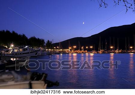Port of Vassiliki in the moonlight, Lefkas or Lefkada, Greece, Europe View Large Photo Image Stock Photograph - Port of Vassiliki in the moonlight, Lefkas or Lefkada, Greece, Europe. Fotosearch