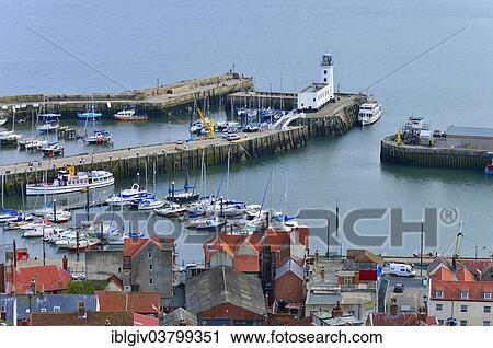 "Port with the Scarborough Lighthouse, Scarborough, North Yorkshire, England, United Kingdom, Europe" View Large Photo Image Stock Image - "Port with the Scarborough Lighthouse, Scarborough, North Yorkshire, England, United Kingdom, Europe". Fotosearch
