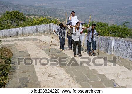 "Porters carrying a Jain pilgrim up Mount Shatrunjaya, Palitana, Gujarat, India, Asia" View Large Photo Image Stock Image - "Porters carrying a Jain pilgrim up Mount Shatrunjaya, Palitana, Gujarat, India, Asia". Fotosearch