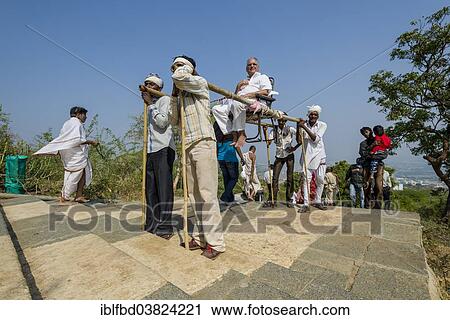 "Porters carrying a Jain pilgrim up Mount Shatrunjaya, Palitana, Gujarat, India, Asia" View Large Photo Image Stock Image - "Porters carrying a Jain pilgrim up Mount Shatrunjaya, Palitana, Gujarat, India, Asia". Fotosearch