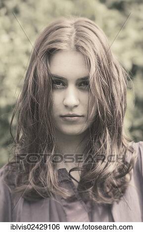 Stock Photograph - Portrait of a confident young woman. Fotosearch