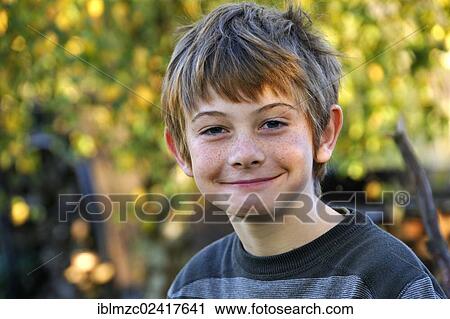 Portrait of a freckled boy, smiling, ten years old, Othenstorf, Mecklenburg-Western Pomerania, Germany, Europe View Large Photo Image Stock Image - Portrait of a freckled boy, smiling, ten years old, Othenstorf, Mecklenburg-Western Pomerania, Germany, Europe. Fotosearch
