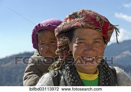 "Portrait of a local mother, carrying her child on her back, Phurteng, Solukhumbu District, Sagarmatha Zone, Nepal, Asia" View Large Photo Image Stock Image - "Portrait of a local mother, carrying her child on her back, Phurteng, Solukhumbu District, Sagarmatha Zone, Nepal, Asia". Fotosearch