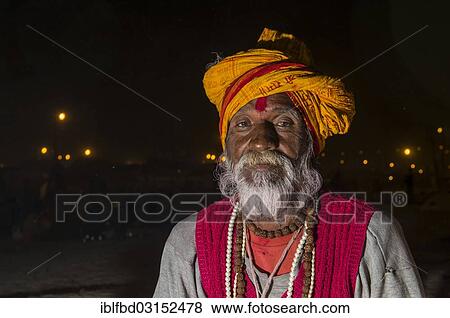 "Portrait of a male pilgrim at night at the Sangam, the confluence of the rivers Ganges, Yamuna and Saraswati, during Kumbha Mela festival, Allahabad, Uttar Pradesh, India, Asia" View Large Photo Image Stock Photo - "Portrait of a male pilgrim at night at the Sangam, the confluence of the rivers Ganges, Yamuna and Saraswati, during Kumbha Mela festival, Allahabad, Uttar Pradesh, India, Asia". Fotosearch