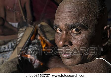 "Portrait of a man joining the initiation of new sadhus, during Kumbha Mela festival at night, Allahabad, Uttar Pradesh, India, Asia" View Large Photo Image Stock Photo - "Portrait of a man joining the initiation of new sadhus, during Kumbha Mela festival at night, Allahabad, Uttar Pradesh, India, Asia". Fotosearch