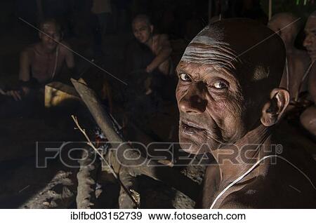 "Portrait of a man joining the initiation of new sadhus, during Kumbha Mela festival at night, Allahabad, Uttar Pradesh, India, Asia" View Large Photo Image Stock Photo - "Portrait of a man joining the initiation of new sadhus, during Kumbha Mela festival at night, Allahabad, Uttar Pradesh, India, Asia". Fotosearch
