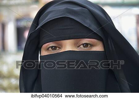 Picture - "Portrait of a Muslim woman, veiled, Salalah, Dhofar Region, Orient, Oman, Asia". Fotosearch