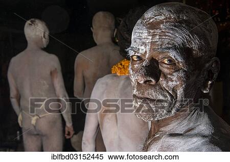 Stock Photography - "Portrait of a newly initiated Shiva sadhu from Avahan Akhara, within a group of fellow sadhus, during Kumbha Mela festival, Allahabad, Uttar Pradesh, India, Asia". Fotosearch