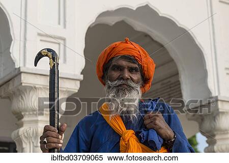 "Portrait of a Nihang, a member of an armed Sikh order, wearing a traditional dress at the Harmandir Sahib or Golden Temple, a holy Sikh temple, Amritsar, Punjab, India, Asia" View Large Photo Image Stock Photography - "Portrait of a Nihang, a member of an armed Sikh order, wearing a traditional dress at the Harmandir Sahib or Golden Temple, a holy Sikh temple, Amritsar, Punjab, India, Asia". Fotosearch
