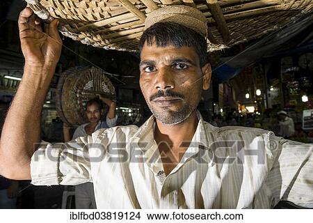 Picture - "Portrait of a porter at Crawfort Market, Mumbai, Maharashtra, India, Asia". Fotosearch