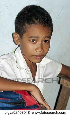 Stock Photo - "Portrait of a school boy, primary school in the village of Areyskat near Phnom Penh, Cambodia, Southeast Asia, Asia". Fotosearch