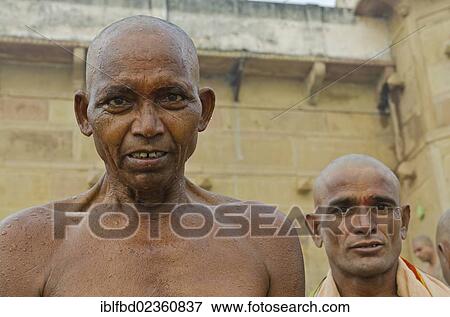 "Portrait of a shaved man, shaving head and beard is part of the ritual to pray farewell for the soul of a deceased person, at the ghats of Varanasi, India, Asia" View Large Photo Image Stock Photo - "Portrait of a shaved man, shaving head and beard is part of the ritual to pray farewell for the soul of a deceased person, at the ghats of Varanasi, India, Asia". Fotosearch
