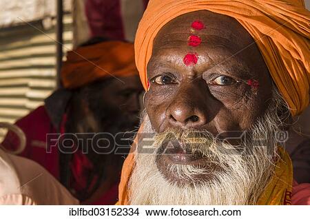 Picture - "Portrait of a Shiva sadhu, holy man, at the Sangam, the confluence of the rivers Ganges, Yamuna and Saraswati, during Kumbha Mela festival, Allahabad, Uttar Pradesh, India, Asia". Fotosearch