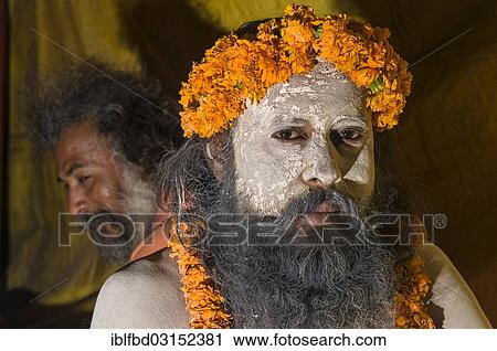 Stock Image - "Portrait of a Shiva sadhu, holy man, at the Sangam, the confluence of the rivers Ganges, Yamuna and Saraswati, during Kumbha Mela festival, Allahabad, Uttar Pradesh, India, Asia". Fotosearch