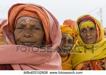 Stock Photo - "Portrait of a Shiva sadhvi, holy woman, at the Sangam, the confluence of the rivers Ganges, Yamuna and Saraswati, during Kumbha Mela festival, Allahabad, Uttar Pradesh, India, Asia". Fotosearch