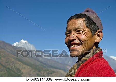 "Portrait of a smiling local man, snowy mountains in the background, Paiya, Solukhumbu District, Sagarmatha Zone, Nepal, Asia" View Large Photo Image Stock Photo - "Portrait of a smiling local man, snowy mountains in the background, Paiya, Solukhumbu District, Sagarmatha Zone, Nepal, Asia". Fotosearch