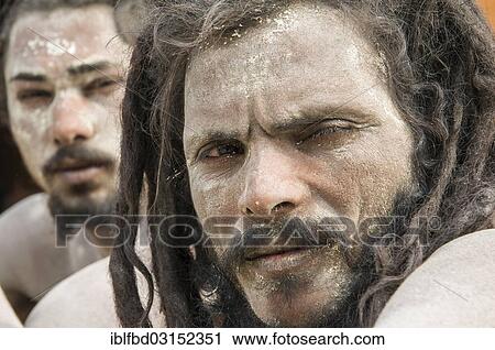 Stock Image - "Portrait of a Udaisin Sadhu, holy man, at the Sangam, the confluence of the rivers Ganges, Yamuna and Saraswati, during Kumbha Mela festival, Allahabad, Uttar Pradesh, India, Asia". Fotosearch