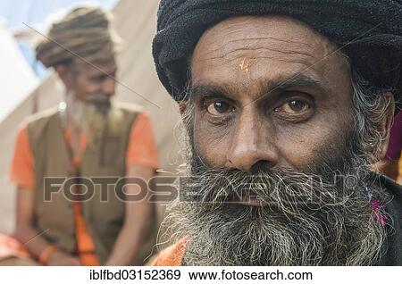 Stock Photo - "Portrait of a Udaisin Sadhu, holy man, at the Sangam, the confluence of the rivers Ganges, Yamuna and Saraswati, during Kumbha Mela festival, Allahabad, Uttar Pradesh, India, Asia". Fotosearch