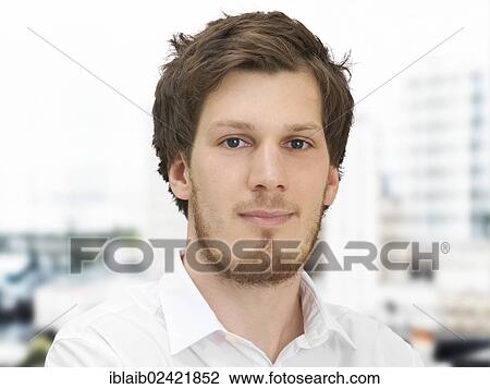 Portrait of a young man, looking calm, relaxed, serious View Large Photo Image Stock Image - Portrait of a young man, looking calm, relaxed, serious. Fotosearch