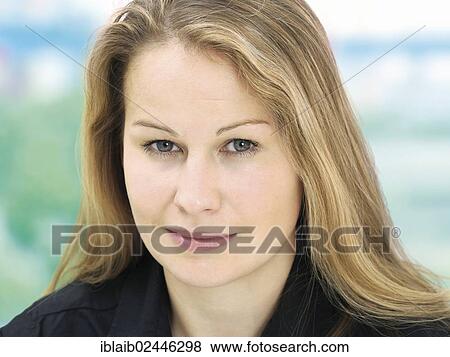 Stock Photo - "Portrait of a young woman, friendly, relaxed". Fotosearch