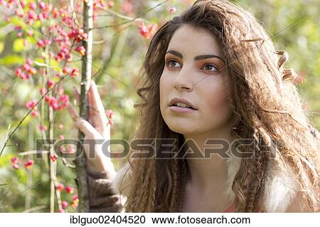 Portrait of a young woman outdoors in autumn View Large Photo Image Stock Image - Portrait of a young woman outdoors in autumn. Fotosearch