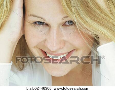 "Portrait of a young woman, smiling" View Large Photo Image Stock Photograph - "Portrait of a young woman, smiling". Fotosearch