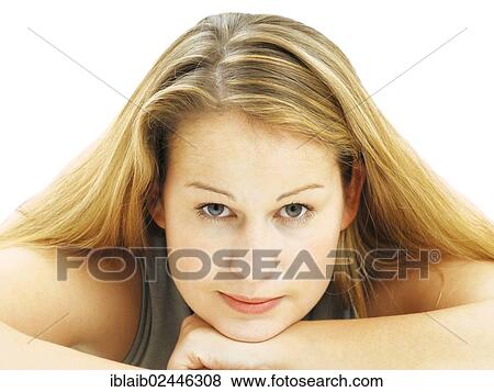 Stock Photo - Portrait of a young woman with a serious face. Fotosearch