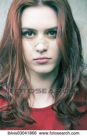Stock Photograph - "Portrait of a young woman with a band-aid on her nose, Sweden, Europe". Fotosearch