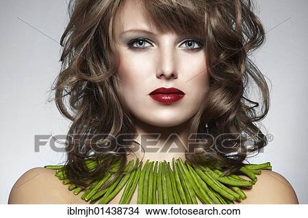 "Portrait of a young woman with green beans as a necklace, jewelry" View Large Photo Image Picture - "Portrait of a young woman with green beans as a necklace, jewelry". Fotosearch