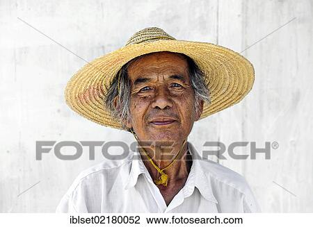 "Portrait of an elderly man wearing a straw hat at Inle Lake in Myanmar, Burma, Southeast Asia, Asia" View Large Photo Image Stock Image - "Portrait of an elderly man wearing a straw hat at Inle Lake in Myanmar, Burma, Southeast Asia, Asia". Fotosearch