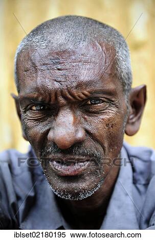 "Portrait of an elderly man with a grim look, probably of Indian origin, in Yangon, Myanmar, Burma, Southeast Asia, Asia" View Large Photo Image Stock Photography - "Portrait of an elderly man with a grim look, probably of Indian origin, in Yangon, Myanmar, Burma, Southeast Asia, Asia". Fotosearch