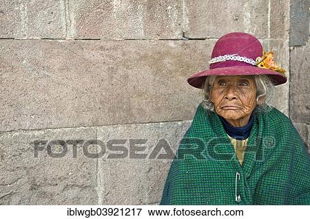 "Portrait of an elderly woman in traditional dress of the Quechua Indians sitting on the floor in front of an Inca wall, Cusco Province, Peru, South America" View Large Photo Image Stock Photo - "Portrait of an elderly woman in traditional dress of the Quechua Indians sitting on the floor in front of an Inca wall, Cusco Province, Peru, South America". Fotosearch