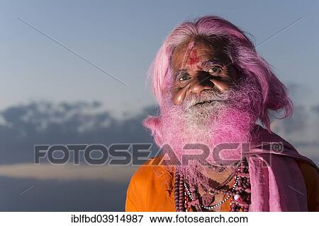 Stock Photo - "Portrait of an old man with a pink beard at the Holi festival, Vrindavan, Uttar Pradesh, India, Asia". Fotosearch