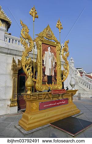 Stock Image - "Portrait of King Bhumibol Adulyadej, or Rama IX, at the Temple of the Golden Buddha or Wat Traimit, Bangkok, Thailand, Asia". Fotosearch