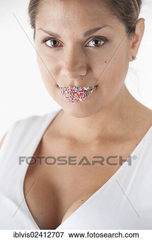 Portrait of woman with colorful sprinkles on her lips View Large Photo Image Stock Photo - Portrait of woman with colorful sprinkles on her lips. Fotosearch