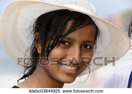 Stock Photography - "Portrait of young Indian woman wearing a hat, Kerala, South India, India, Asia". Fotosearch