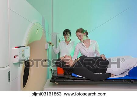 Stock Image - "Positioning a patient in a computed tomography, CT scanner, Germany, Europe". Fotosearch