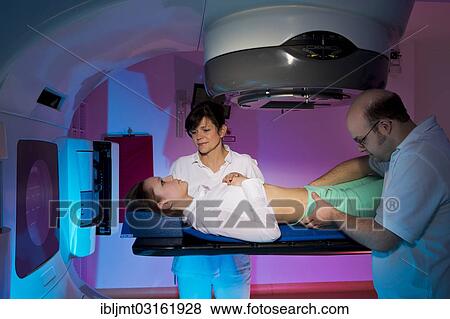 Stock Photo - "Positioning and adjusting a patient in a linear particle accelerator for radiation treatment, Germany, Europe". Fotosearch
