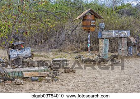 Stock Image - "Post office barrel, since 1792, still in use, Floreana Island, Galapagos, Ecuador, South America". Fotosearch