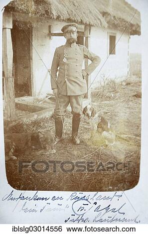Stock Photograph - "Postcard, field post, German officer wearing a medal with hunting dogs in front of a thatched house in Galicia, Russian Campaign, World War I, around 1915, Gallizien, unbekannt, Gallizien, Russia, Europe". Fotosearch