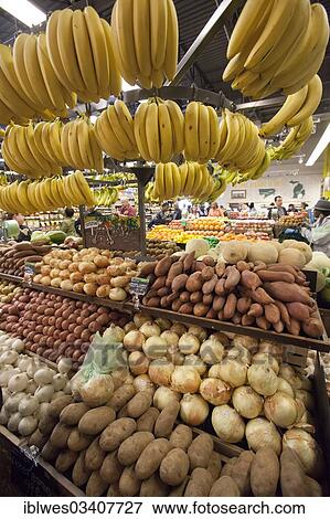 Stock Photo - "Potatoes, onions and bananas at a whole foods supermarket, Detroit, Michigan, United States, North America". Fotosearch