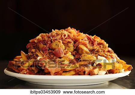 "Poutine, a Canadian fast food specialty, Quebec Province, Canada, North America" View Large Photo Image Stock Photo - "Poutine, a Canadian fast food specialty, Quebec Province, Canada, North America". Fotosearch