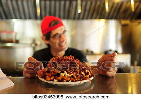 Stock Photography - "Poutine, a Canadian fast food specialty, Quebec Province, Canada, North America". Fotosearch