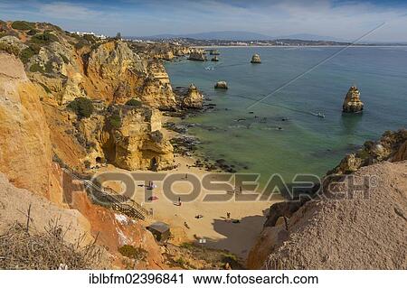 "Praia do Camilo beach with Praia Dona Ana beach at back, Lagos, Algarve, Portugal, Europe" View Large Photo Image Stock Image - "Praia do Camilo beach with Praia Dona Ana beach at back, Lagos, Algarve, Portugal, Europe". Fotosearch