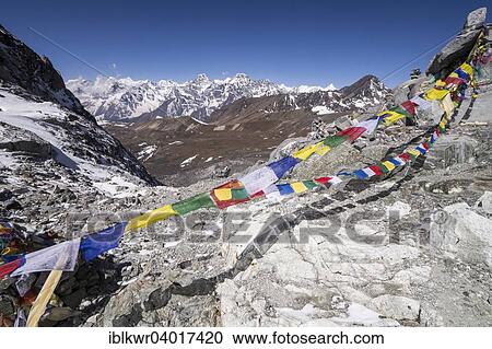 Stock Image - "Prayer flags at the Cho La Pass in front of mountains, Khumbu, Solukhumbu District, Everest Region, Nepal, Asia". Fotosearch