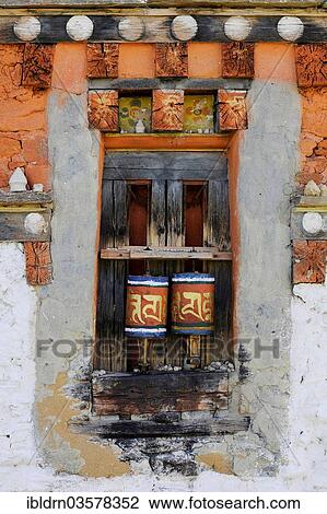 "Prayer wheels in the outer wall of a temple, Jakar, Bumthang district, Bhutan, Asia" View Large Photo Image Stock Image - "Prayer wheels in the outer wall of a temple, Jakar, Bumthang district, Bhutan, Asia". Fotosearch