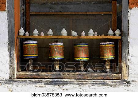 "Prayer wheels in the outer wall of a temple, Jakar, Bumthang district, Bhutan, Asia" View Large Photo Image Stock Image - "Prayer wheels in the outer wall of a temple, Jakar, Bumthang district, Bhutan, Asia". Fotosearch