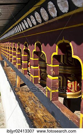 Prayer wheels perspective, Trongsa, Bhutan, Asia View Large Photo Image Stock Photo - Prayer wheels perspective, Trongsa, Bhutan, Asia. Fotosearch