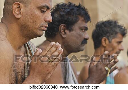 "Praying men performing a ritual for the soul of a deceased person, at the ghats of Varanasi, India, Asia" View Large Photo Image Stock Image - "Praying men performing a ritual for the soul of a deceased person, at the ghats of Varanasi, India, Asia". Fotosearch